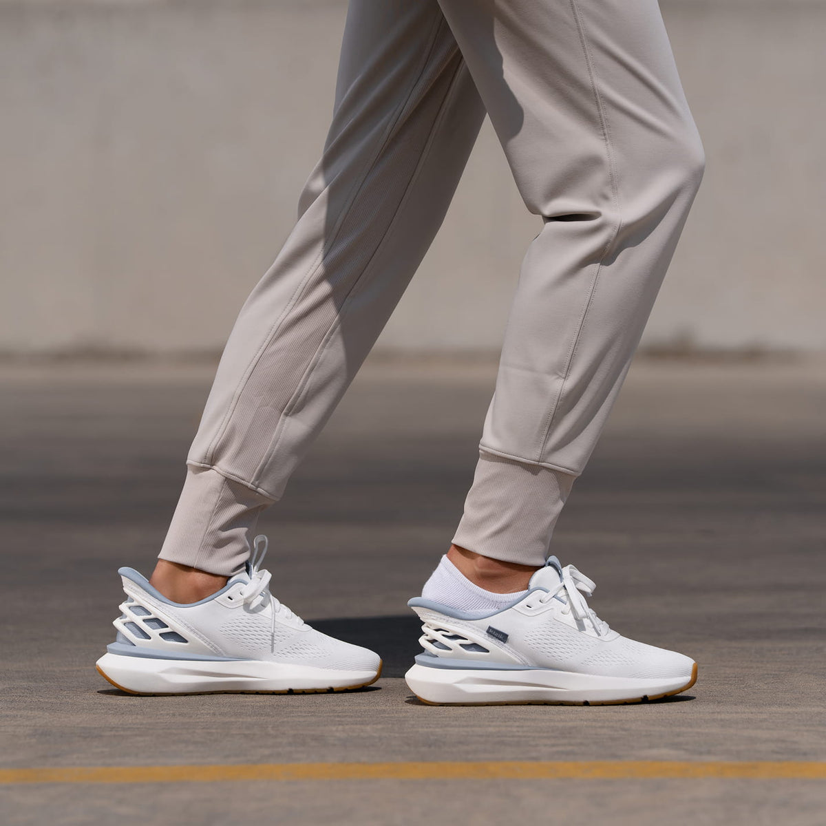 Golfer walking with bag wearing Kizik golf shoes